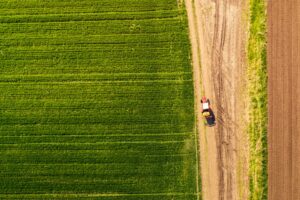Aerial view of tractor with attached crop sprayer